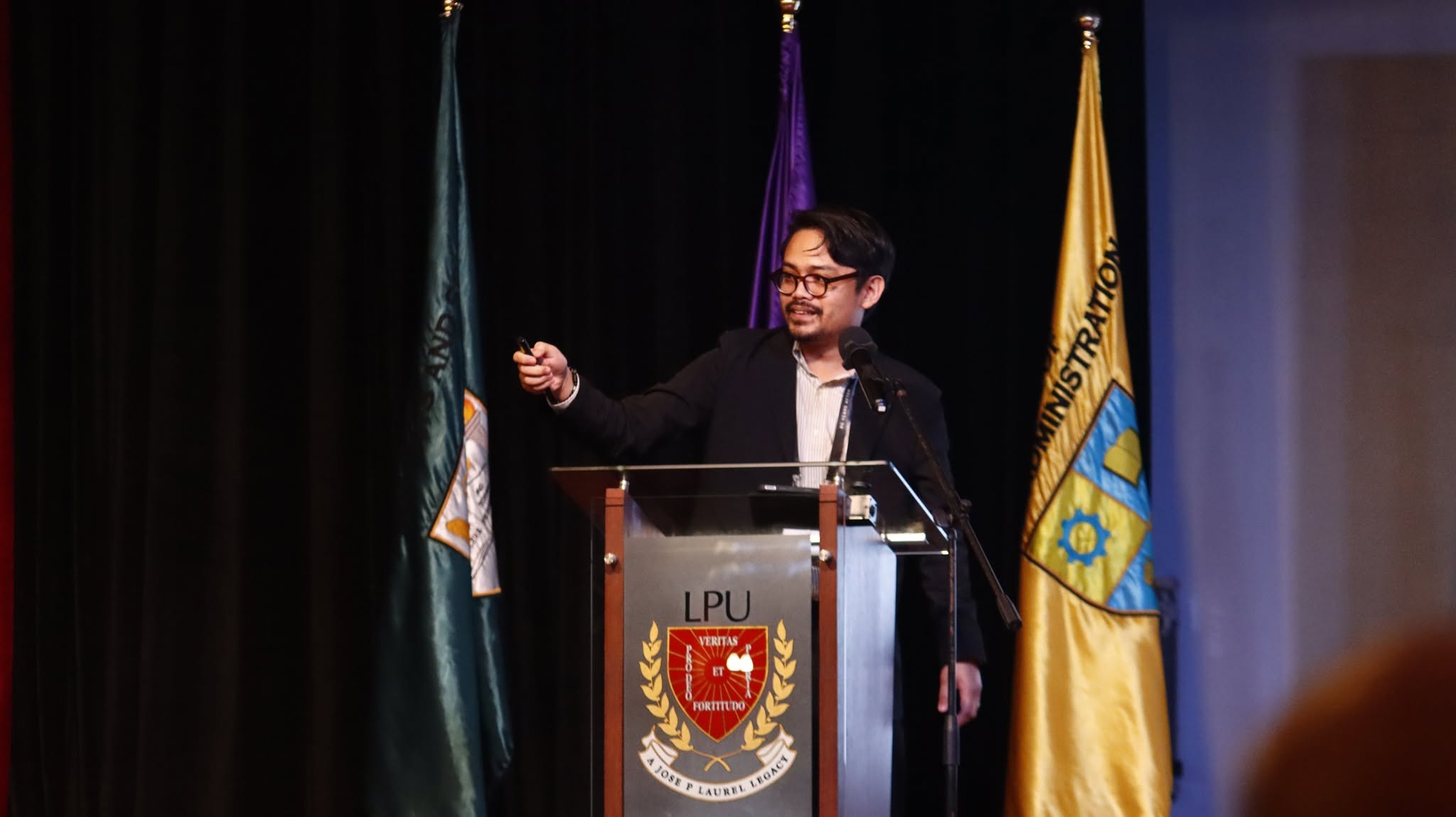 Dr. Bulado speaking at a public or academic event